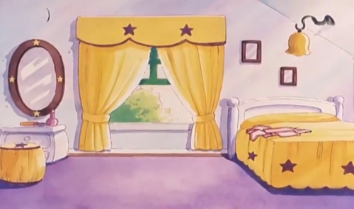 Sue's Room, with yellow curtains and bedsheets, and black star accents.