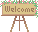 Pixel art of a wooden welcome sign, adorned with flowers.